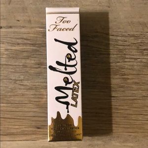 Lip gloss or clear topper by Too Faced